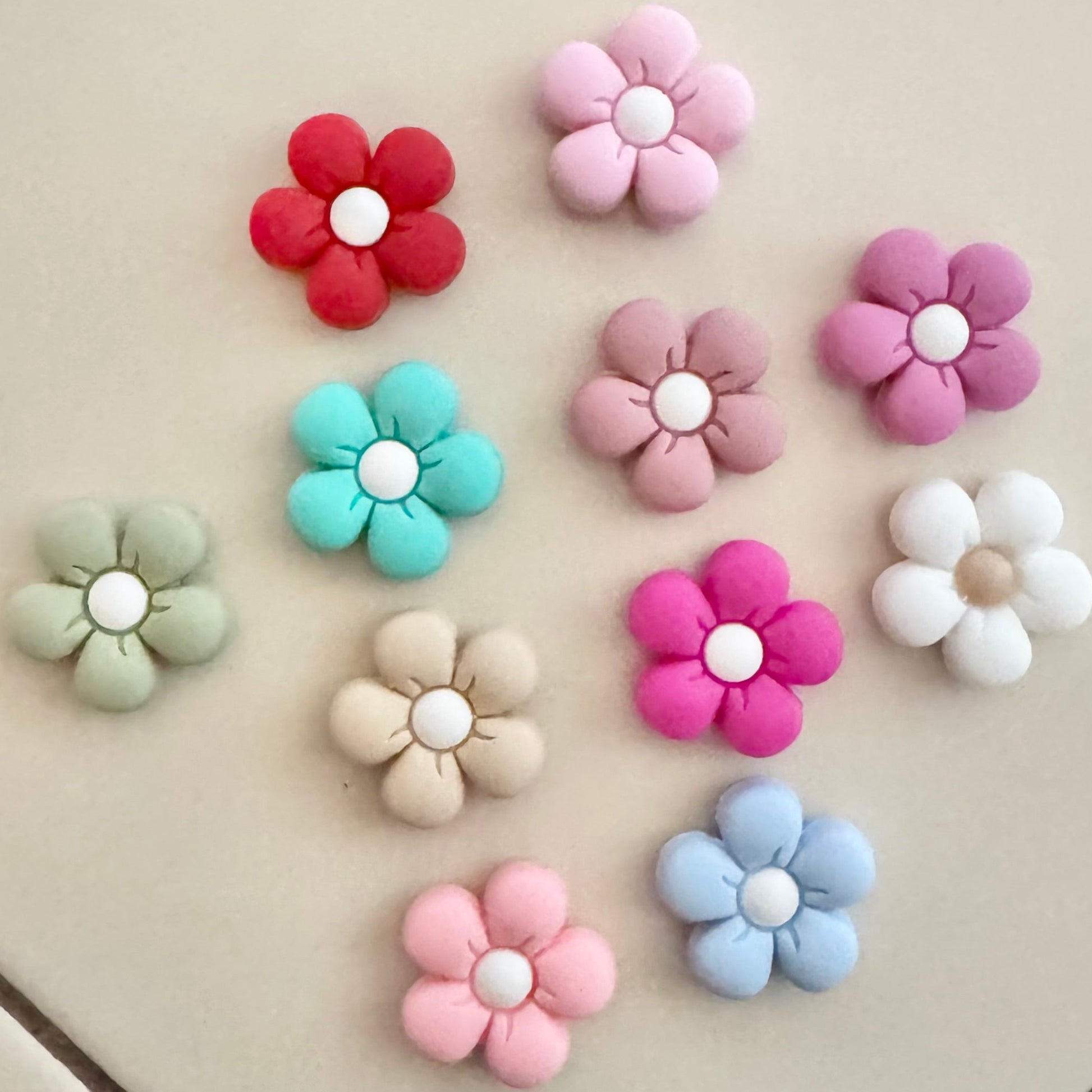 Colorful flower-shaped objects on a tiled floor
