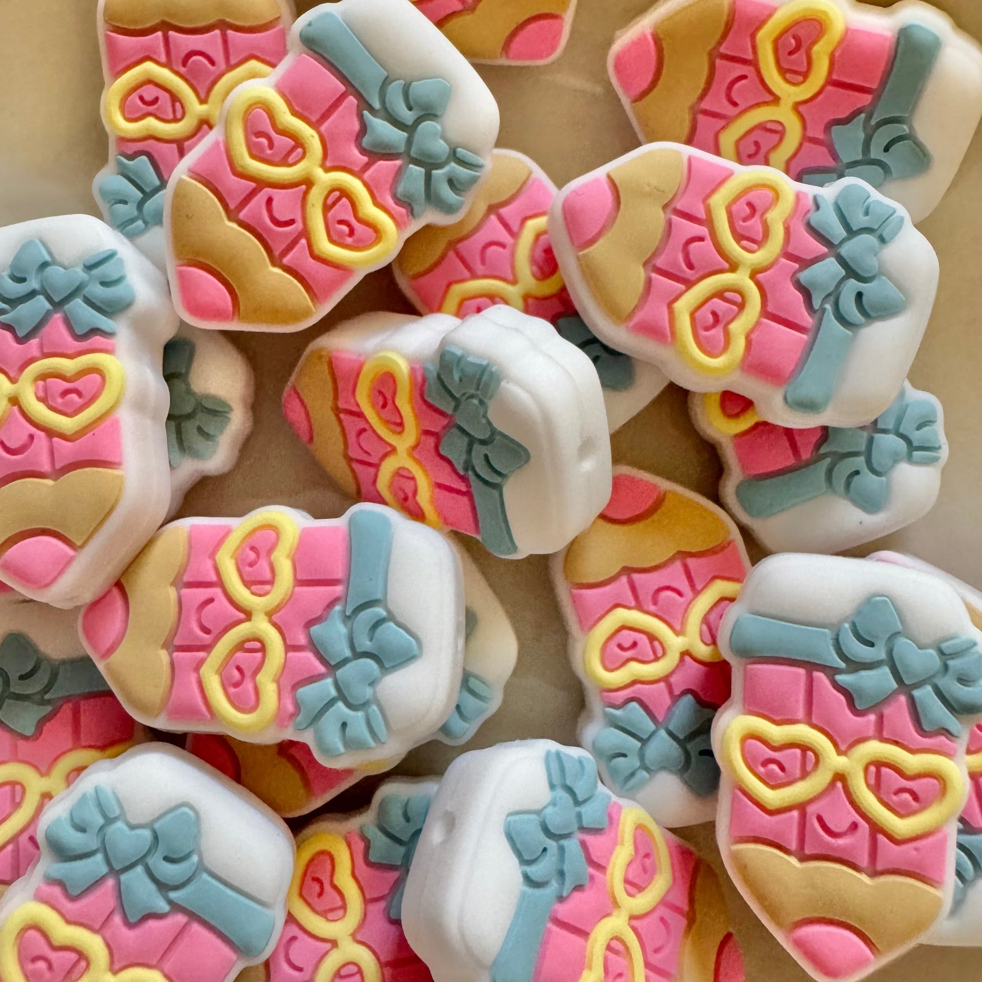 Pen silicone bead colorful designs on a beige background