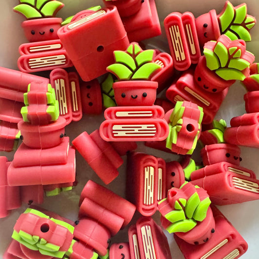 Red and green book shapes on a white background