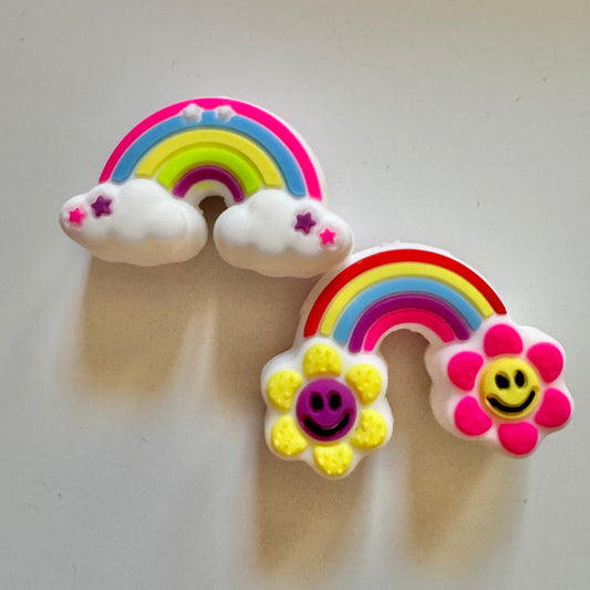 Colorful rainbow and cloud-shaped beads on a light gray background